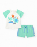 Completo per bambino con t-shirt bianca con stampa tropicale e pantaloncini verdi con dettagli blu