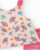 Completo crema per bambina con camicetta con ombrelli e pantaloncini rosa con volant