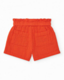 Short naranja para niña con lazo y bolsillos laterales