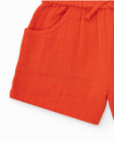 Short naranja para niña con lazo y bolsillos laterales