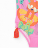 Bañador rosa para niña con estampado tropical y borlas laterales