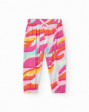Pantalón rosa de plana para niña con estampado tropical y lazo Pantalón rosa de plana para niña con estampado tropical y lazo