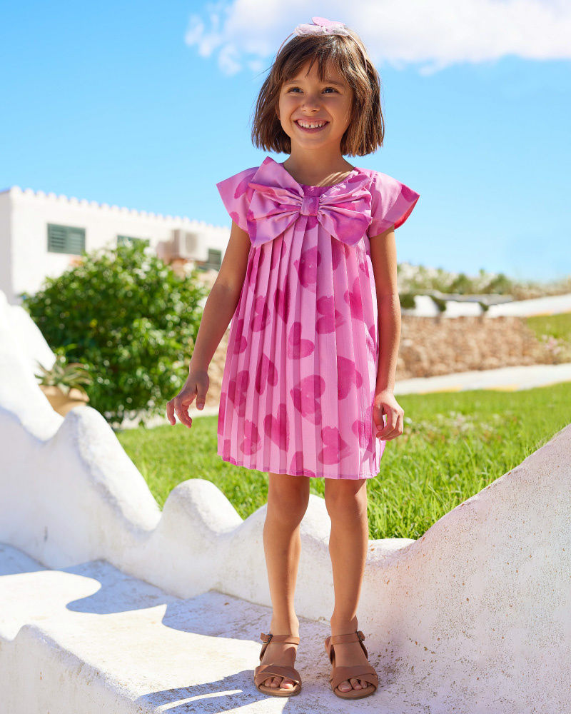 Vestito rosa per bambina con cuori e plissettato