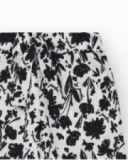 Pantaloni per bambina in bianco con vita elastica e stampa floreale.
