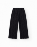 Pantaloni per bambina in nero con vita elastica e ricamo.
