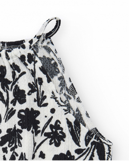 Top per bambina in bianco con spalline e stampa floreale.