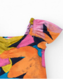 Tuta per bambina multicolore con maniche a sbuffo e scollo arricciato.