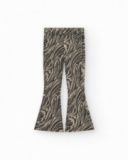 Pantaloni per bambina in nero con stampa animalier e borchie in vita.