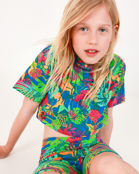 Maglietta per bambina in blu a maniche lunghe con stampa tropicale.
