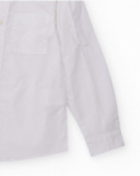 Camicia bianca a maniche lunghe per bambino con taschino e bottone decorativo