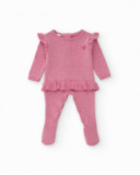 Tutina in maglia per bambina colore rosa con volant decorativi. Tutina in maglia per bambina colore rosa con volant decorativi.