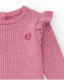 Tutina in maglia per bambina colore rosa con volant decorativi. Tutina in maglia per bambina colore rosa con volant decorativi.