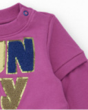 Vestito in maglia per bambina colore magenta con gonna in tulle stampato.