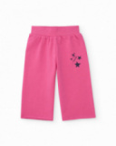 Pantalone in maglia per bambina rosa con dettaglio di stelle stampate.