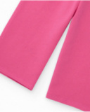 Pantalone in maglia per bambina rosa con dettaglio di stelle stampate.