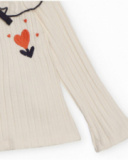 Maglia a costine per bambina in écru con volant e fiocco