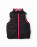 Gilet reversibile da bambina con fiori fucsia e lato nero Gilet reversibile da bambina con fiori fucsia e lato nero