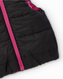 Gilet reversibile da bambina con fiori fucsia e lato nero Gilet reversibile da bambina con fiori fucsia e lato nero