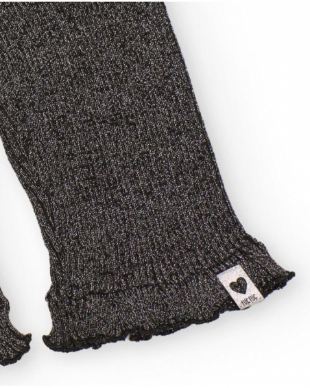 Pantaloni in maglia per bambina in grigio con volant sull’orlo.