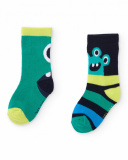 Confezione di calzini per bambino in verde e blu con motivi di mostri e righe.
