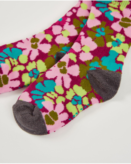 Set di calzini per bambina con fiori e righe in colori vivaci.