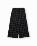 Pantaloni in tweed nero a quadri grigi per bambina