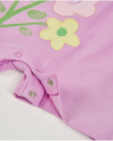 Pagliaccetto in maglia per neonato con fiori applicati