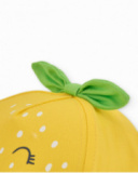 Cappellino da bambina in tessuto con foglie decorative