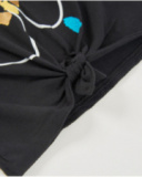 T-shirt in maglia da bambina con nodo decorativo