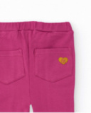 Calça flare para menina na cor fúcsia.