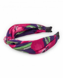 Tiara para menina com estampa floral em tons de vermelho.